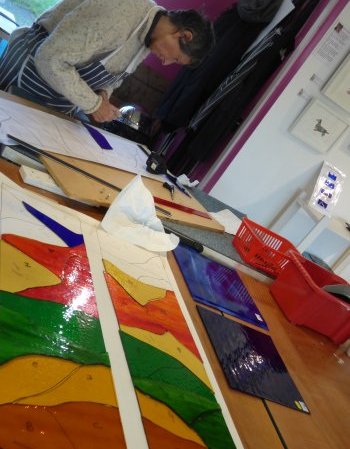 Cutting the glass for two stained glass windows