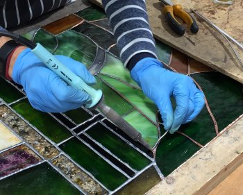 Advanced soldering techniques being taught on this stained glass workshop at Vitreus Art
