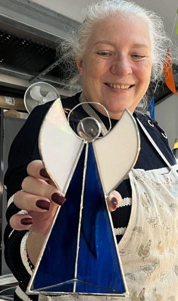 A colourful stained glass Angel candleholder made on the Vitreus Art workshop