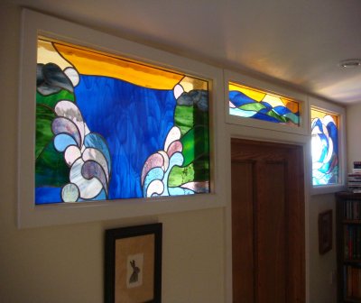Three water-themed stained glass panels commissioned fora  period home
