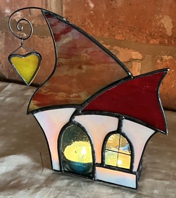 A curved multi-sided candelholder made from stained glass at Vitreus Art