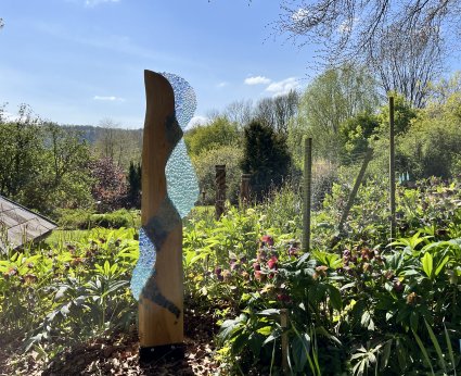 Waters Fall wood and glass sculpture by Vitreus Art on display at Wye Valley Sculpture Garden near Tintern